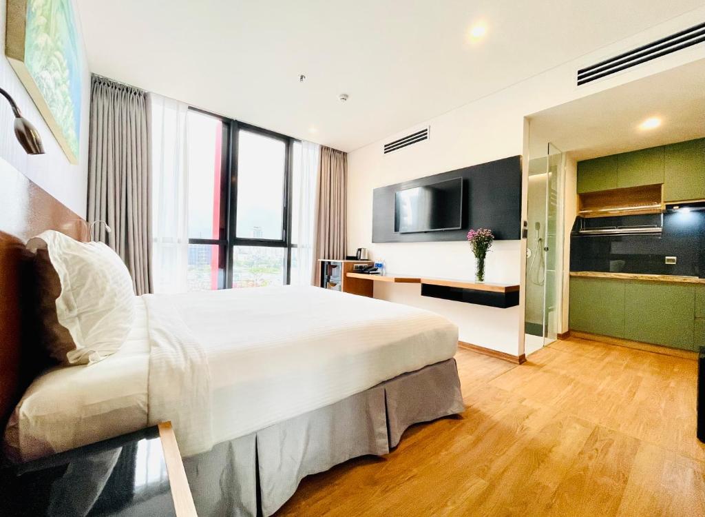 Postel nebo postele na pokoji v ubytování NAM Hotel & Residences