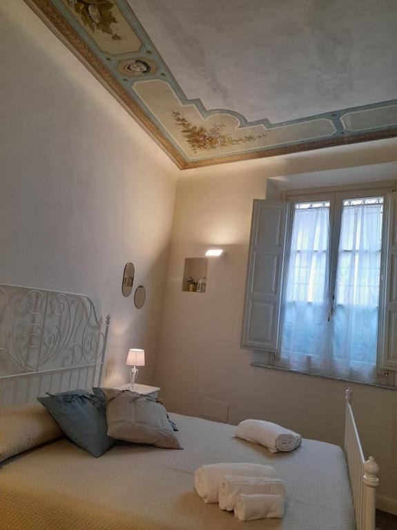 Łóżko lub łóżka w pokoju w obiekcie B&B Villino Luschi Pisa Centro