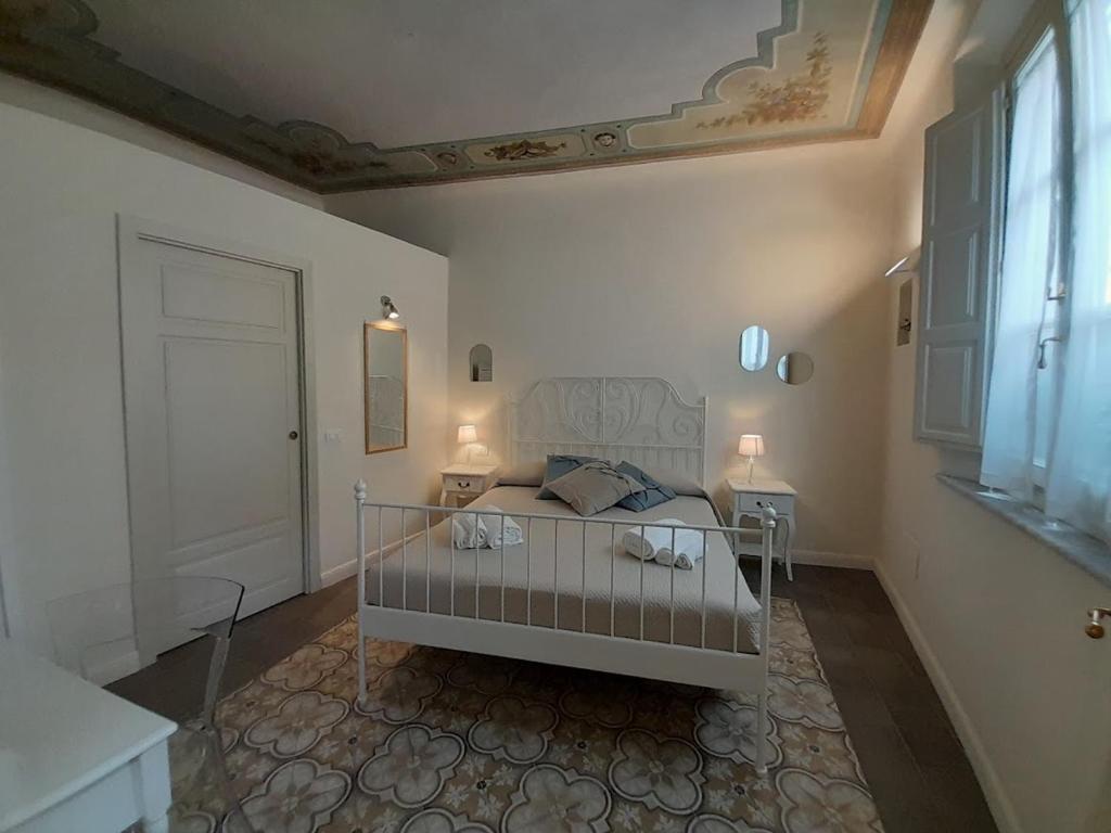 Łóżko lub łóżka w pokoju w obiekcie B&B Villino Luschi Pisa Centro