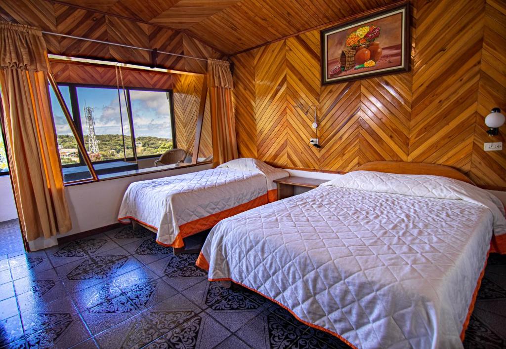 Postel nebo postele na pokoji v ubytování Hotel Don Taco