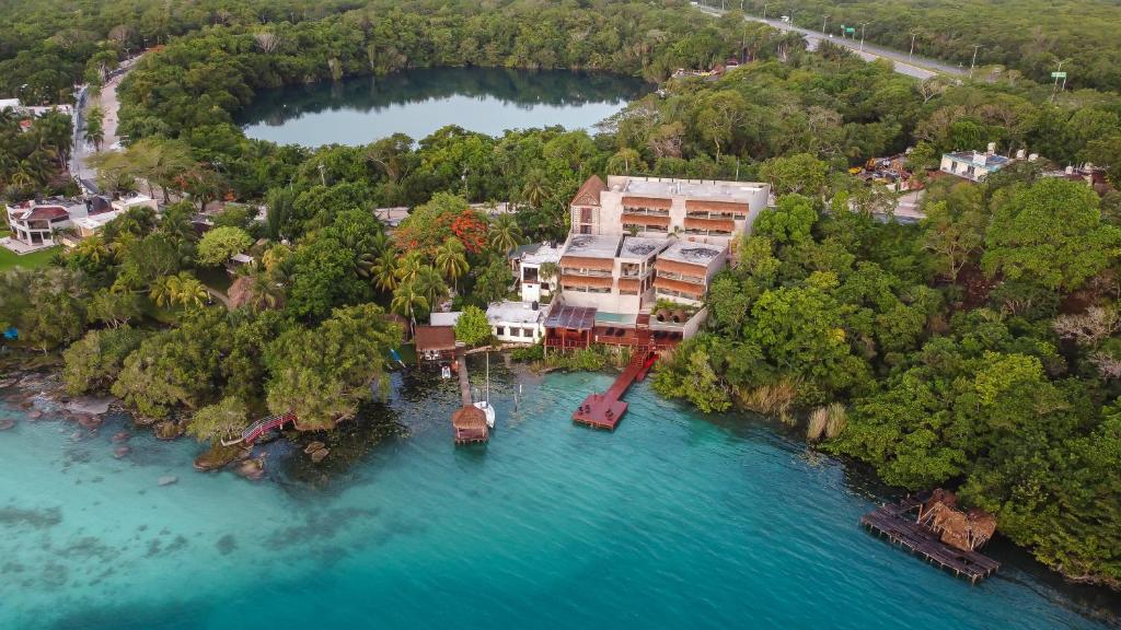 an aerial view of a house on an island in the water at Hotel Amainah Bacalar in Bacalar
