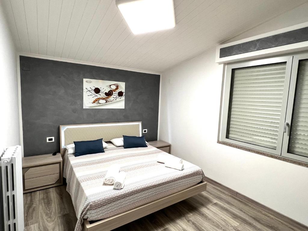 Postel nebo postele na pokoji v ubytování Siclari B&B-Rooms&Suite