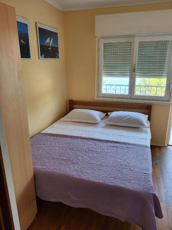 Postel nebo postele na pokoji v ubytování Apartman Ivan