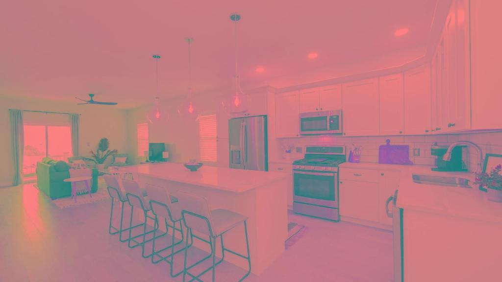 a rendering of a pink kitchen with bar stools at Beautiful New Construction Ventnor Beach House in Ventnor City