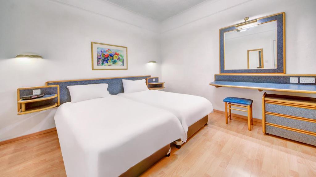 Postel nebo postele na pokoji v ubytování AX Sunny Coast Resort & Spa