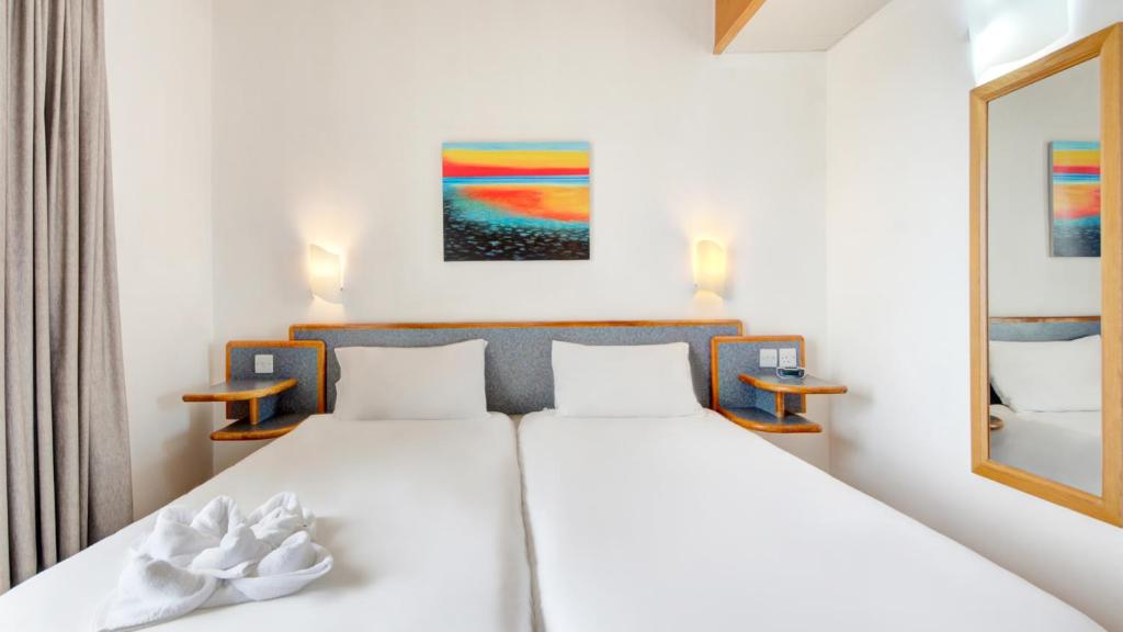 Postel nebo postele na pokoji v ubytování AX Sunny Coast Resort & Spa
