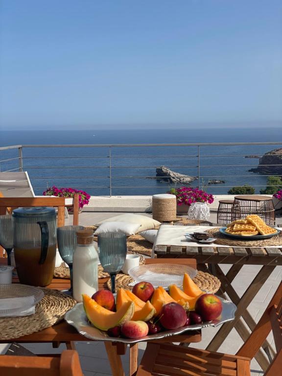 a table with a tray of fruit on it at Cocciu d’amuri in Terrasini