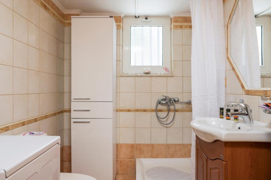 Kúpeľňa v ubytovaní OLIVE BREEZE