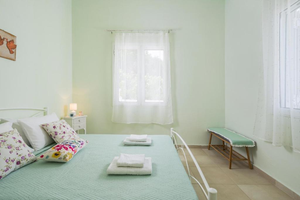 Posteľ alebo postele v izbe v ubytovaní OLIVE BREEZE