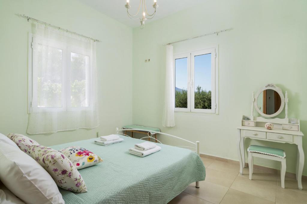 Posteľ alebo postele v izbe v ubytovaní OLIVE BREEZE