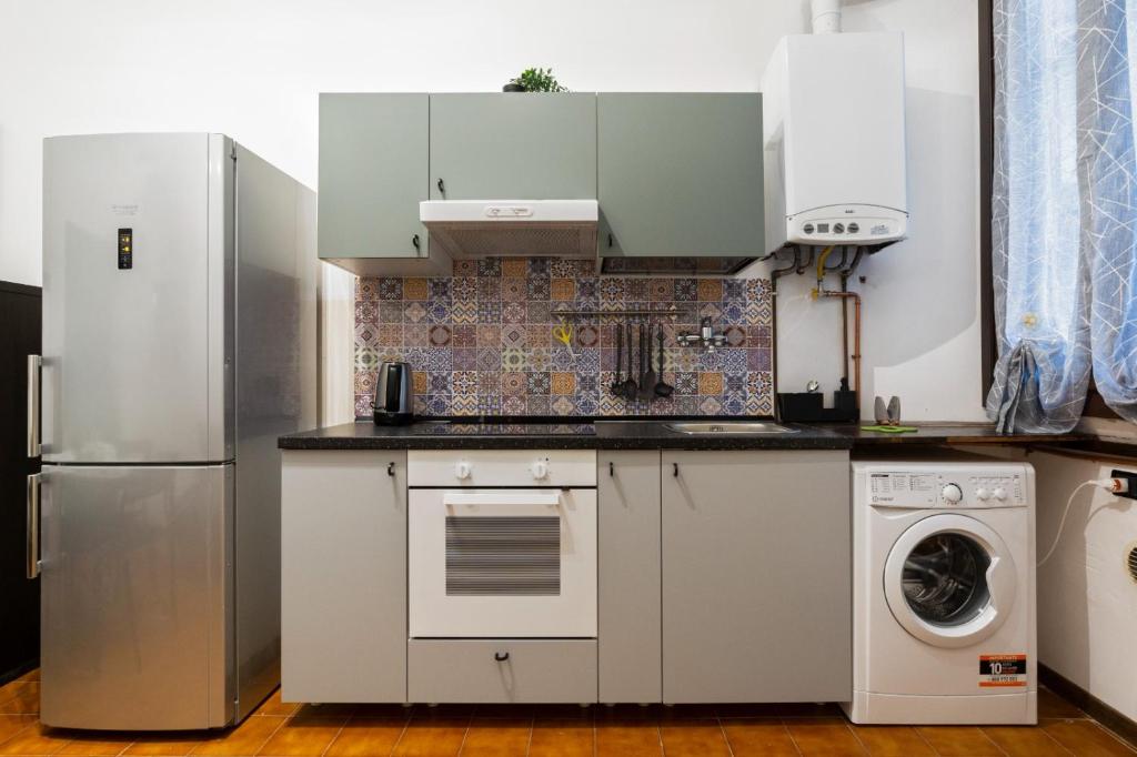 Kuchnia lub aneks kuchenny w obiekcie Cimiano Cozy Apartment