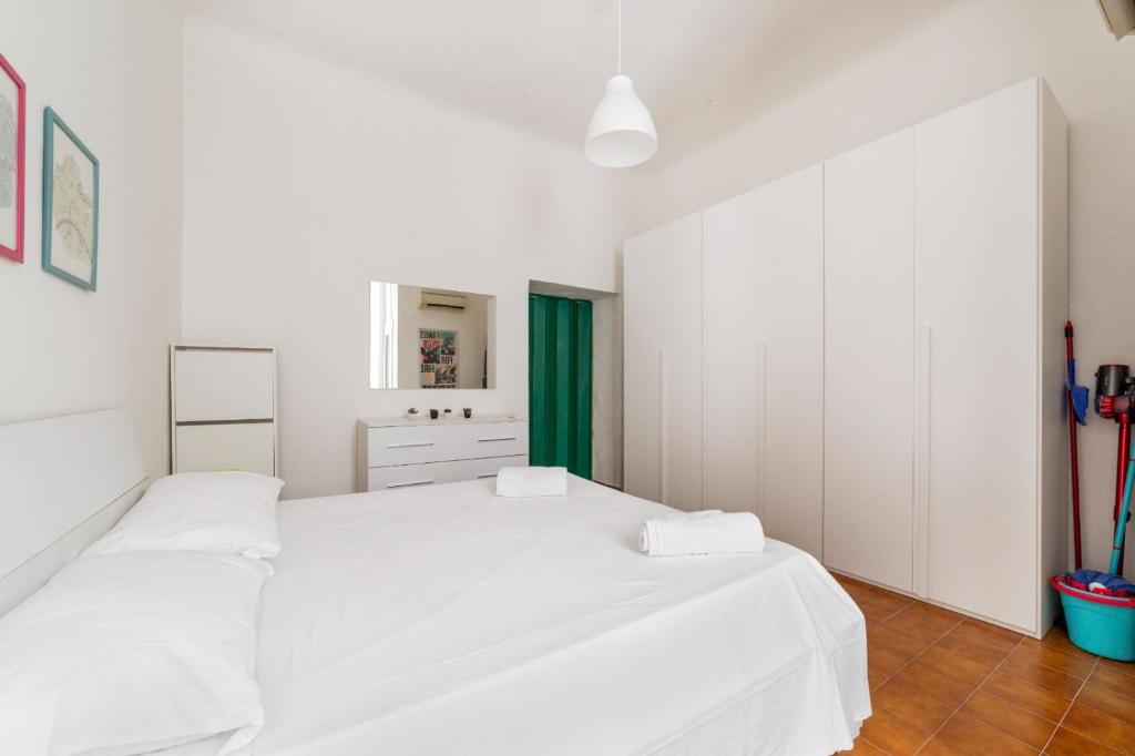 Łóżko lub łóżka w pokoju w obiekcie Cimiano Cozy Apartment