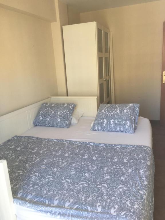 Postel nebo postele na pokoji v ubytování MAGNO CULLERA- Playa