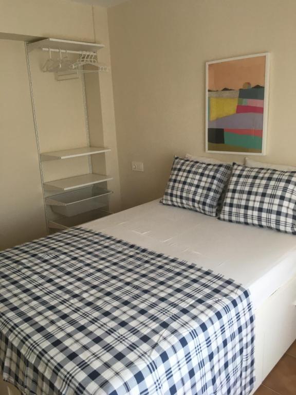 Postel nebo postele na pokoji v ubytování MAGNO CULLERA- Playa