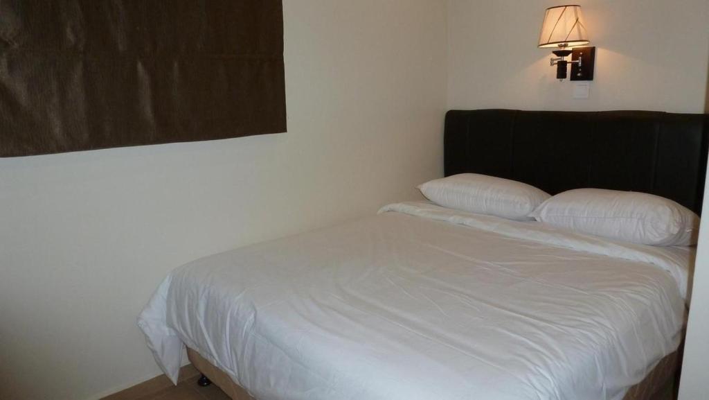 Postel nebo postele na pokoji v ubytování Hotel Hong