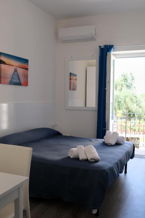 Postel nebo postele na pokoji v ubytování Residence Nina
