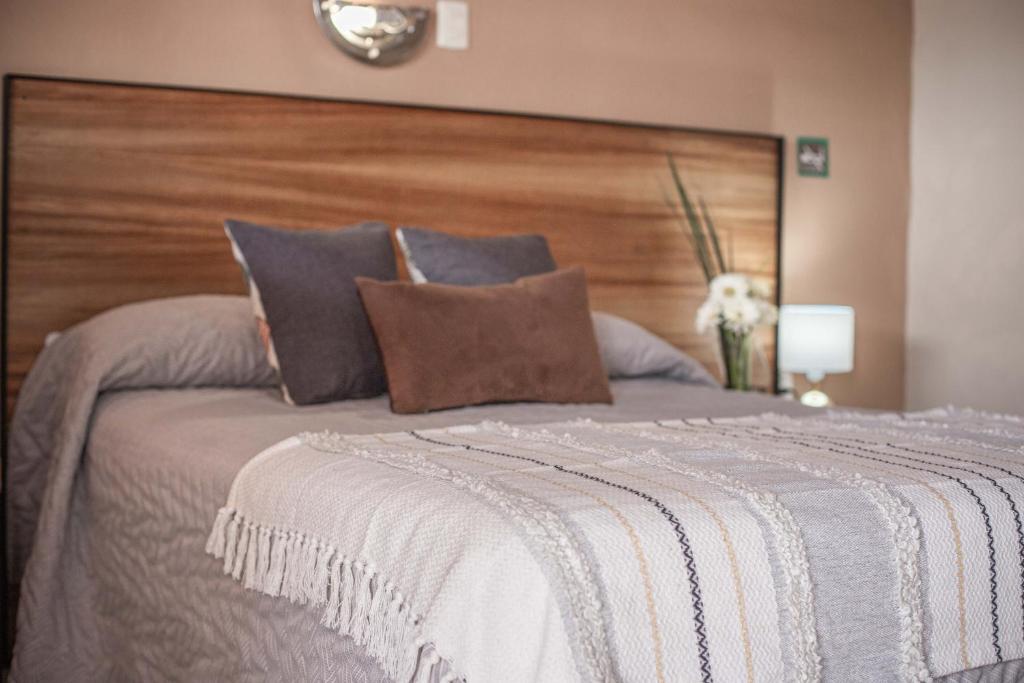 Postel nebo postele na pokoji v ubytování Hotel el Leñador