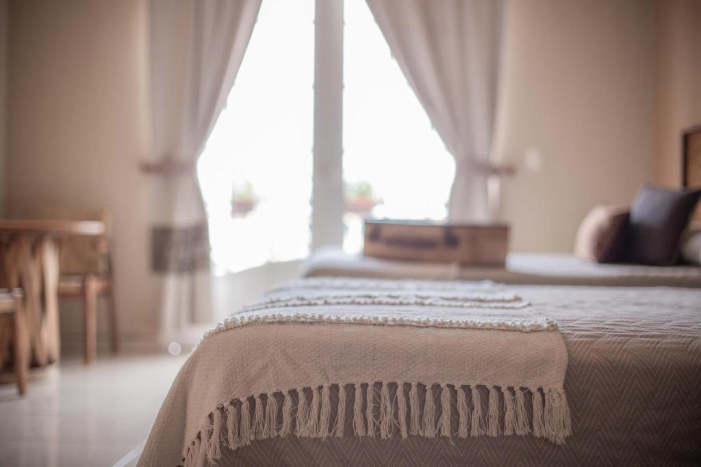 Postel nebo postele na pokoji v ubytování Hotel el Leñador