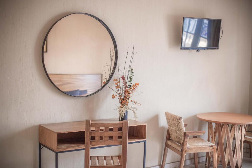 TV a/nebo společenská místnost v ubytování Hotel el Leñador