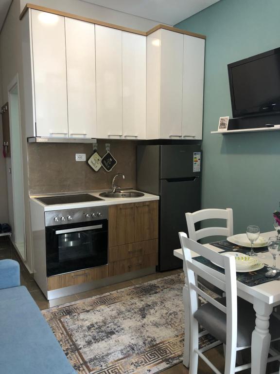 Kuchyň nebo kuchyňský kout v ubytování Rezidenca SHOPI Apartments