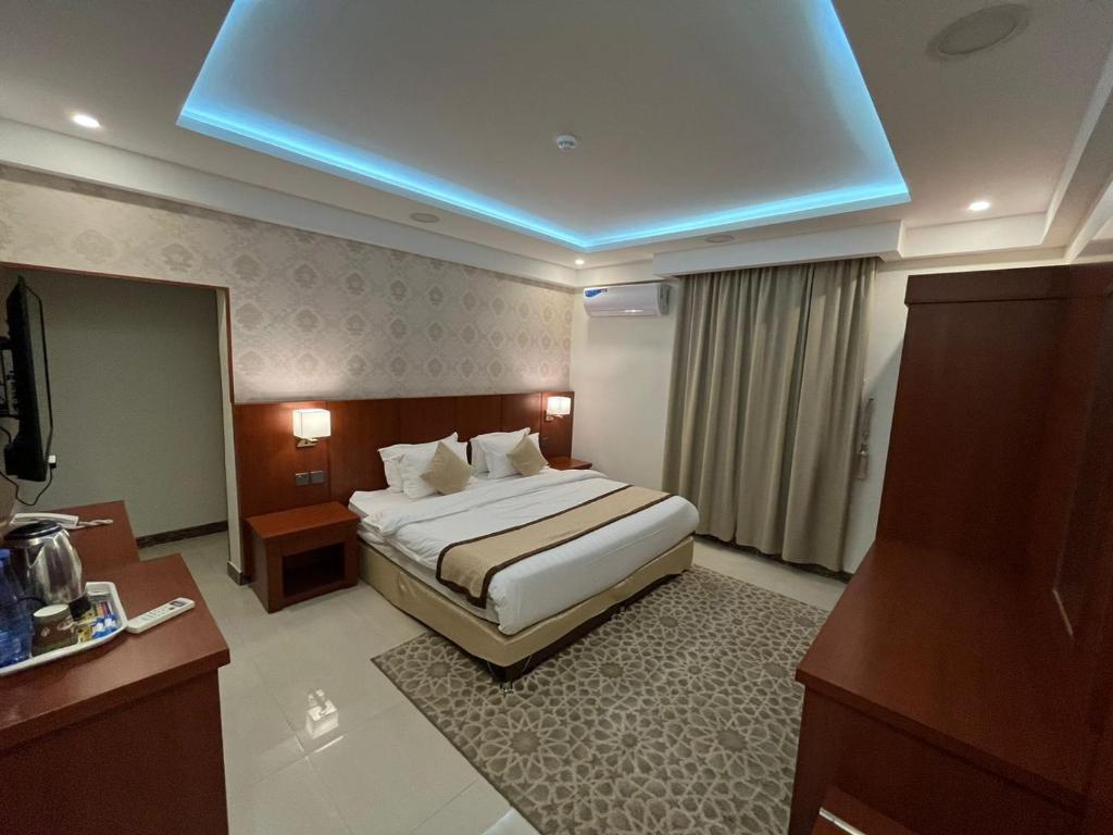 Postel nebo postele na pokoji v ubytování هاوس إن House Inn