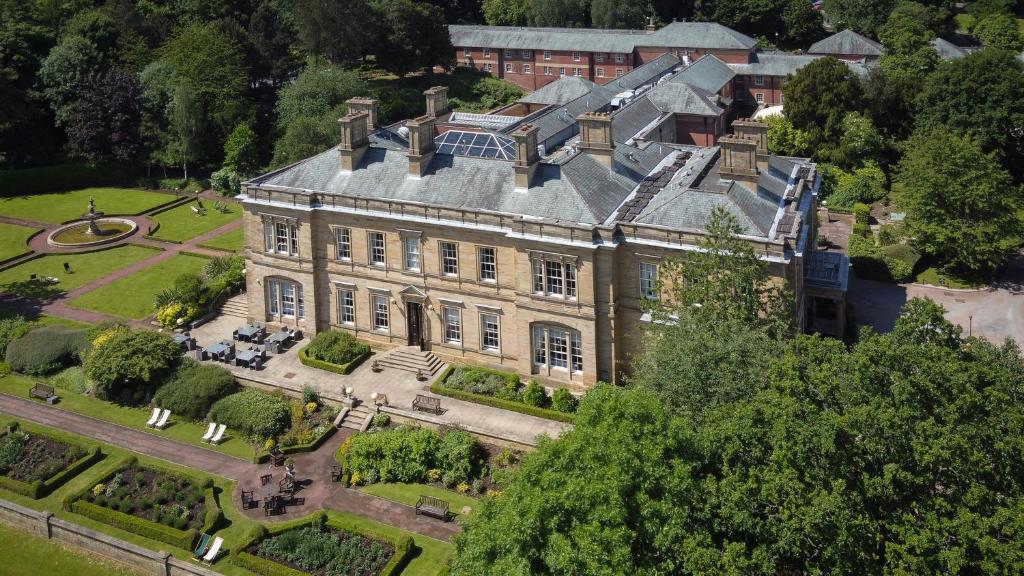 an aerial view of a large house with a garden at Oulton Hall Hotel, Spa & Golf Resort in Leeds