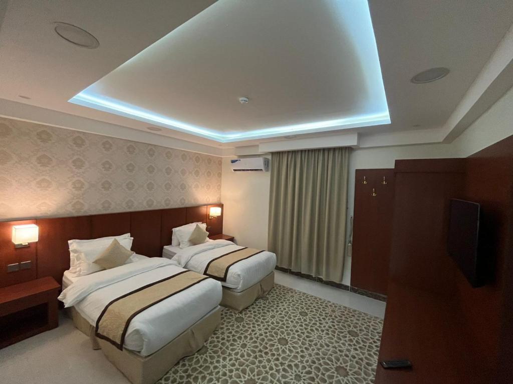 Postel nebo postele na pokoji v ubytování هاوس إن House Inn