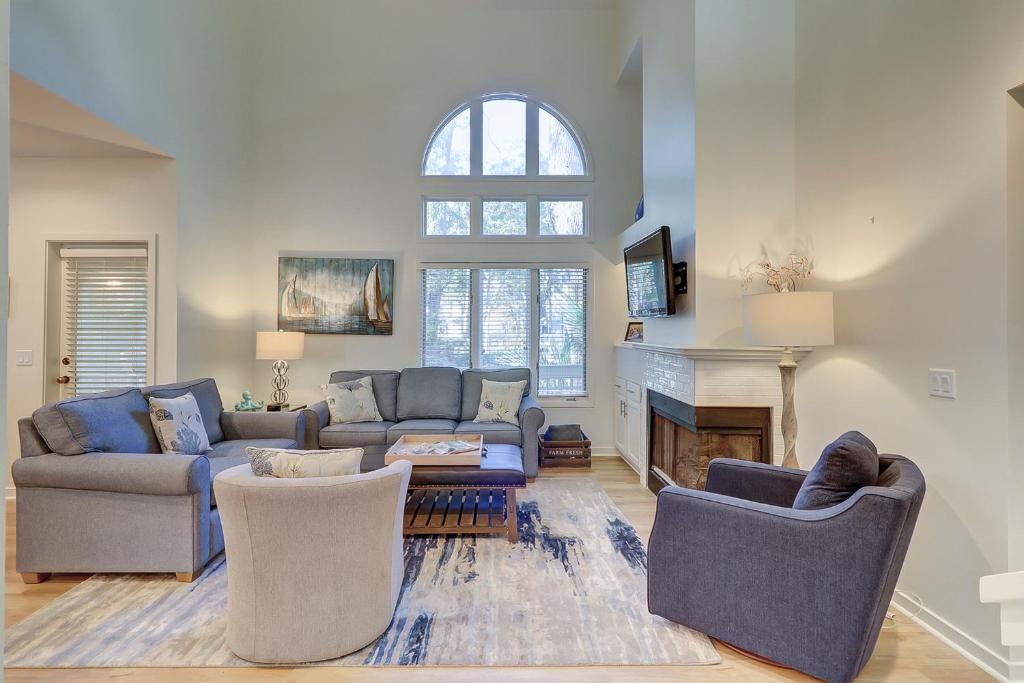 a living room with two couches and a fireplace at 7602 Huntington in Hilton Head Island