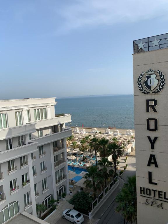 a hotel with the ocean in the background at Royal apartament in Durrës