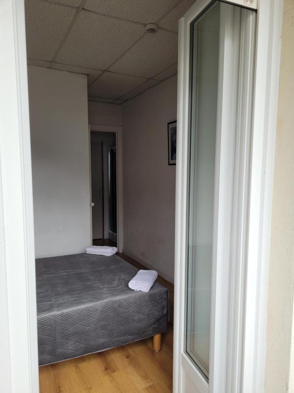 Postel nebo postele na pokoji v ubytování Hôtel Marquette