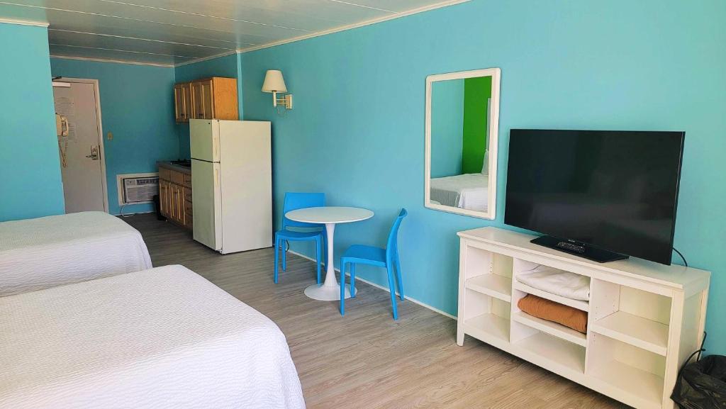 TV a/nebo společenská místnost v ubytování Kokomo Suites
