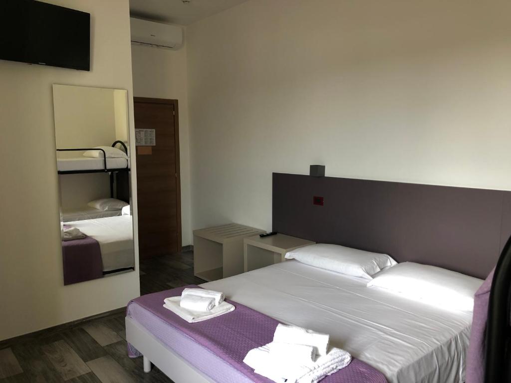 Postel nebo postele na pokoji v ubytování Vinsea Hotel