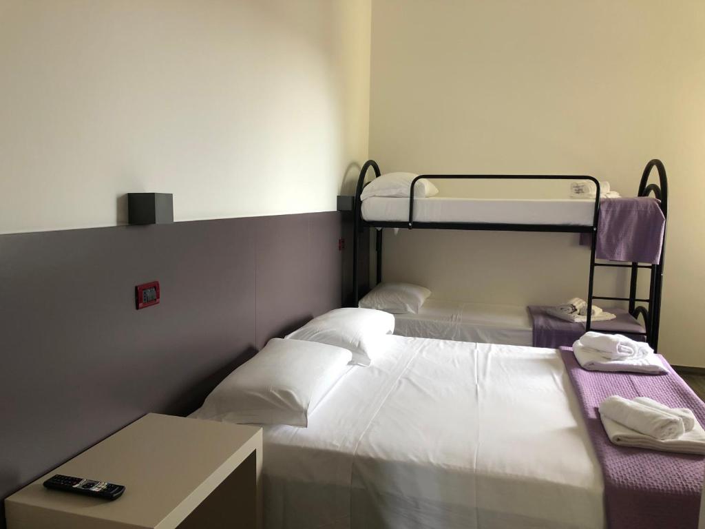 Postel nebo postele na pokoji v ubytování Vinsea Hotel