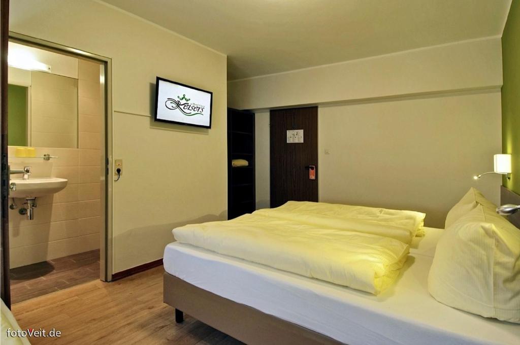 Postel nebo postele na pokoji v ubytování L' Angolo Ristorante & Hotel GmbH