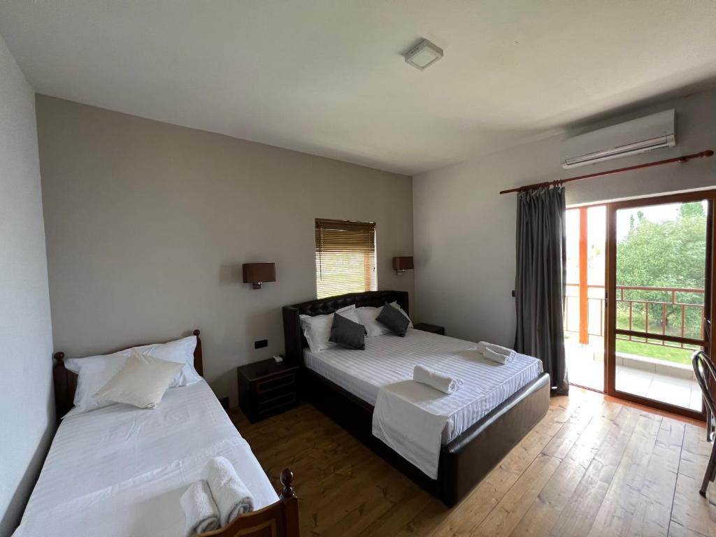 Voodi või voodid majutusasutuse Hotel Victoria toas
