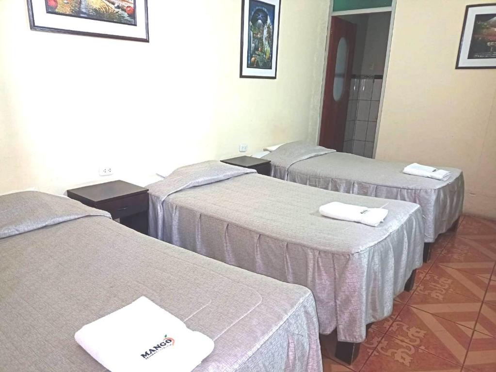 Postel nebo postele na pokoji v ubytování Mango Hostel B&B