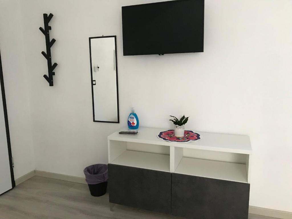 Telewizja i/lub zestaw kina domowego w obiekcie LA ROSA APP