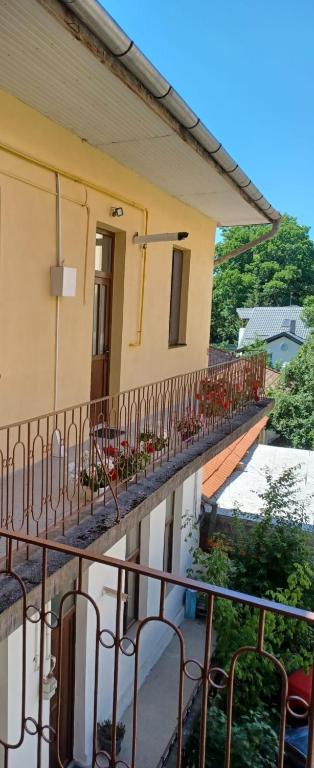 a balcony of a house with chairs on it at M20 Studios in Cluj-Napoca