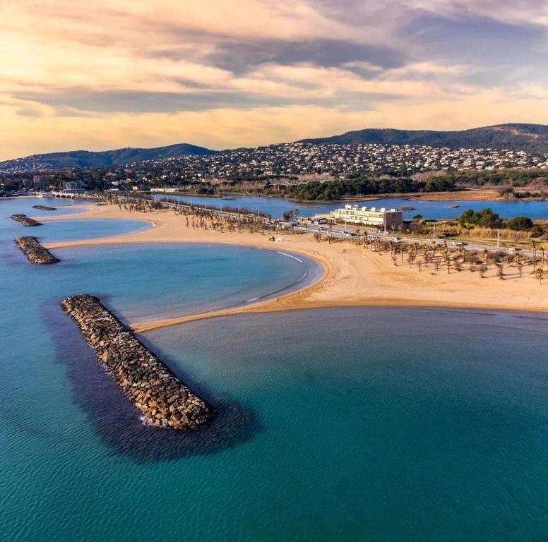 an aerial view of a beach and the ocean at Le Venise 3 Etoiles Frejus in Saint-Aygulf