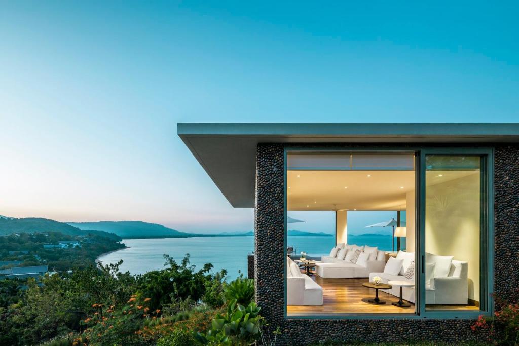a house with a view of the water at COMO Point Yamu, Phuket- SHA Extra Plus in Ban Pa Khlok