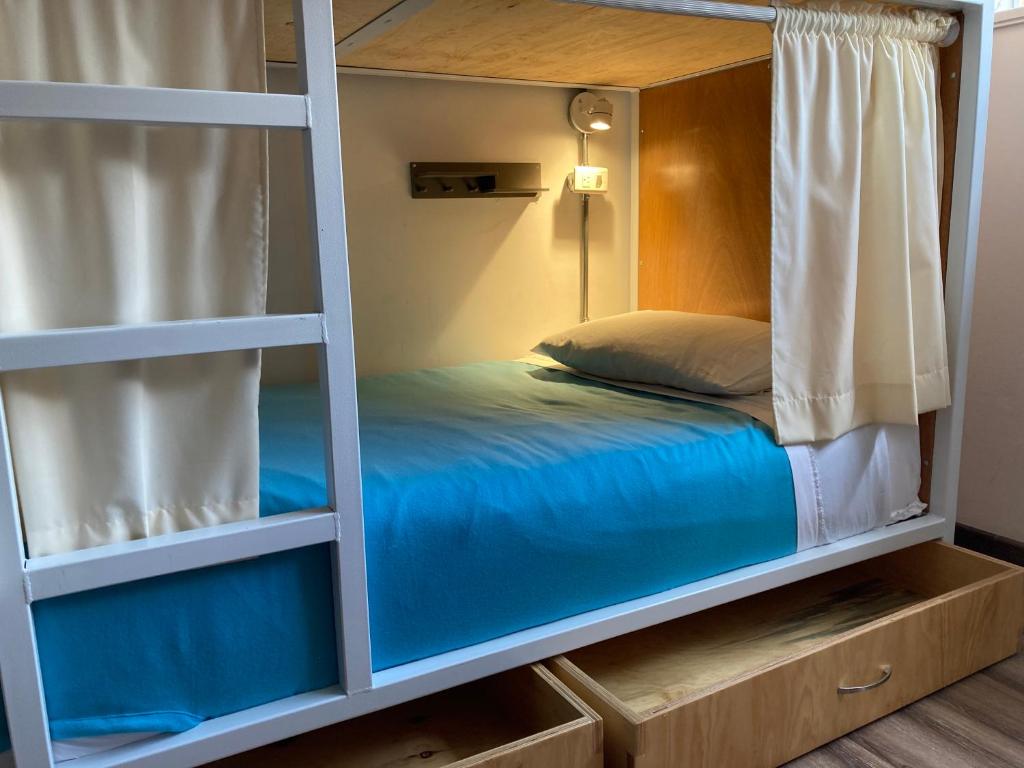 Postel nebo postele na pokoji v ubytování Hostal Macondo Bogotá