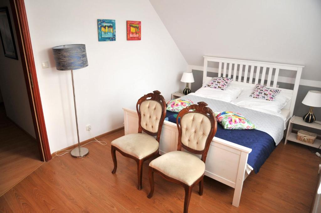 Postel nebo postele na pokoji v ubytování Apartament pod limbą