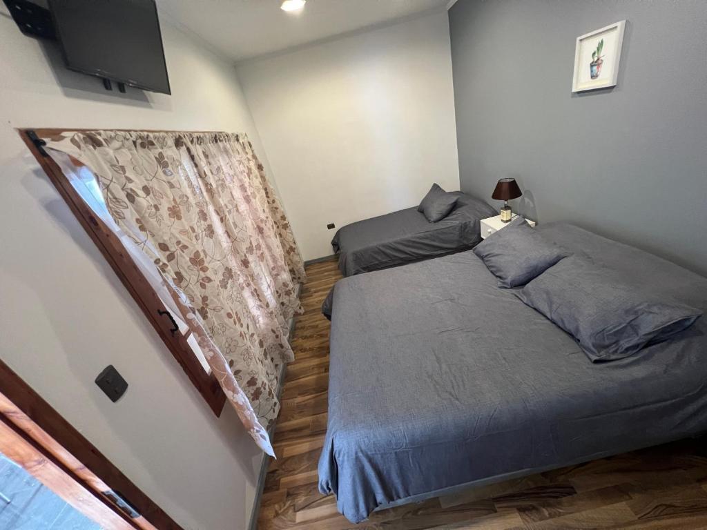 Postel nebo postele na pokoji v ubytování Hostal FloryMar