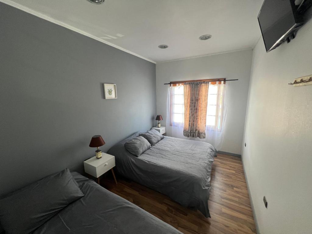 Postel nebo postele na pokoji v ubytování Hostal FloryMar