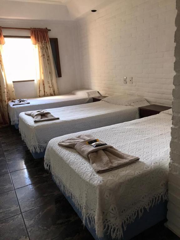 Postel nebo postele na pokoji v ubytování Hosteria Los Cuartos