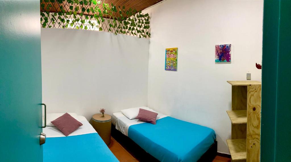 Postel nebo postele na pokoji v ubytování Hostal Macondo Bogotá