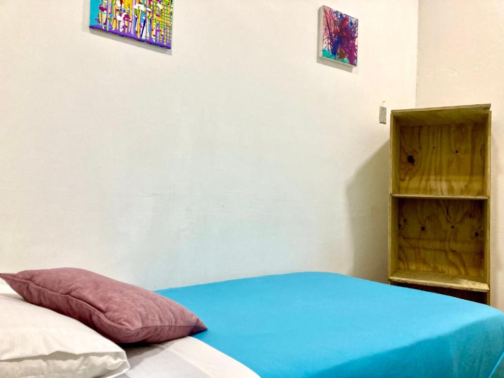 Postel nebo postele na pokoji v ubytování Hostal Macondo Bogotá