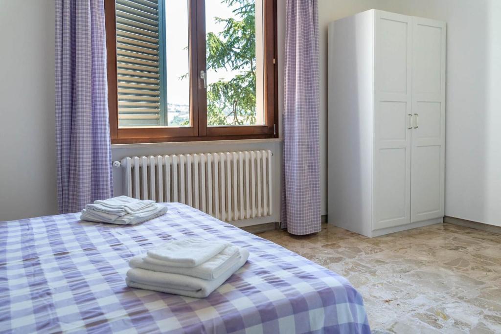 Łóżko lub łóżka w pokoju w obiekcie B&B LA GRADINA