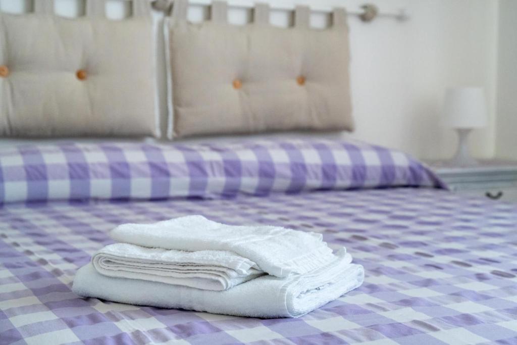 Łóżko lub łóżka w pokoju w obiekcie B&B LA GRADINA