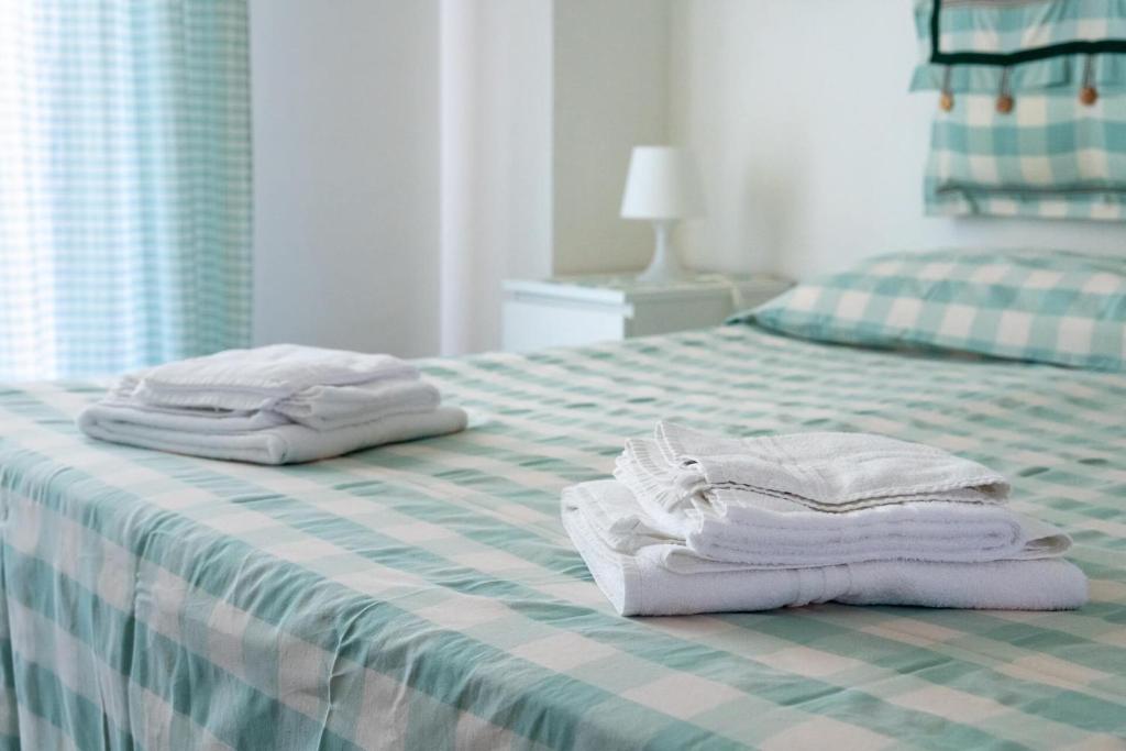 Łóżko lub łóżka w pokoju w obiekcie B&B LA GRADINA